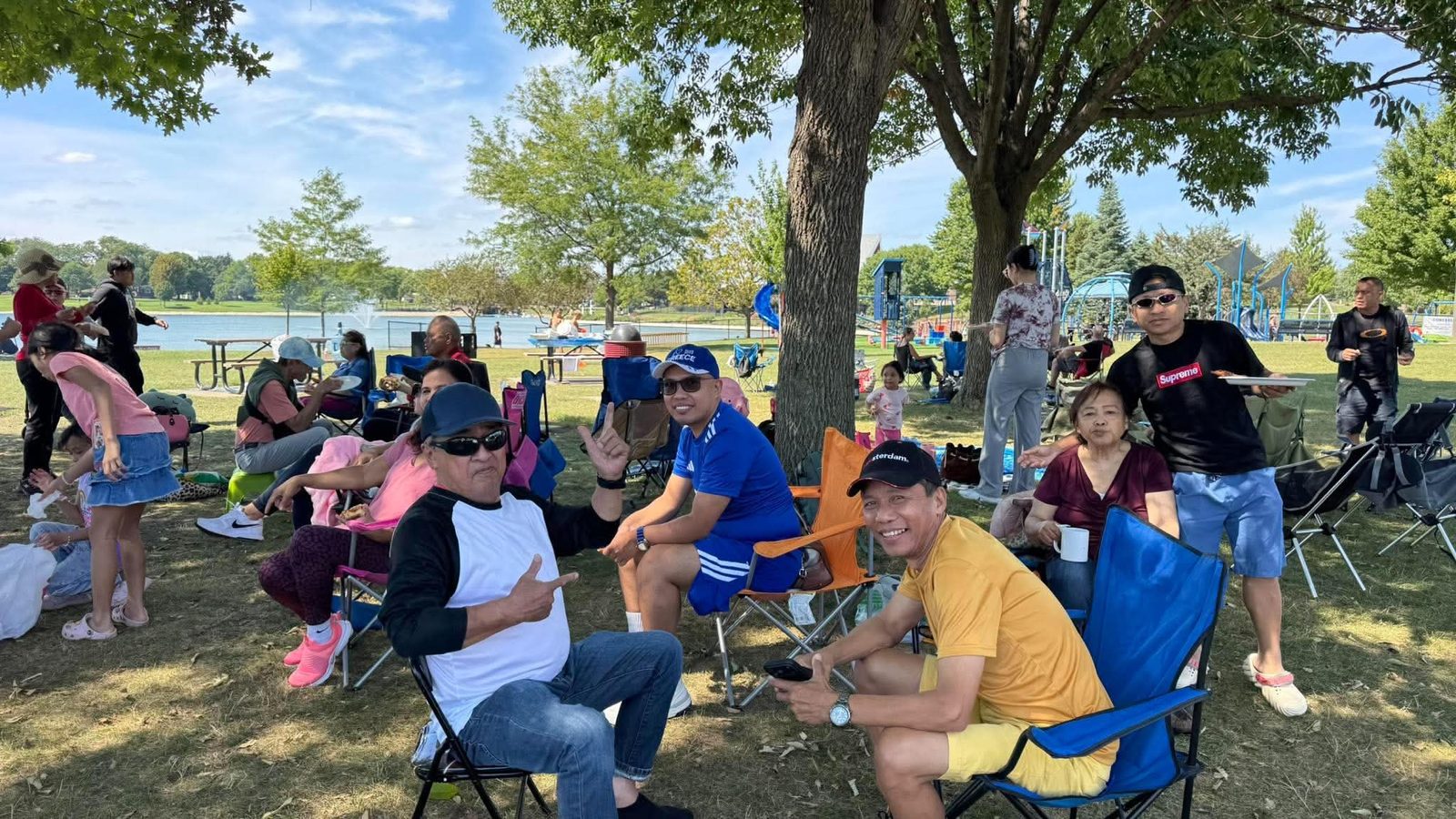 Church members enjoying pizza together at the picnic