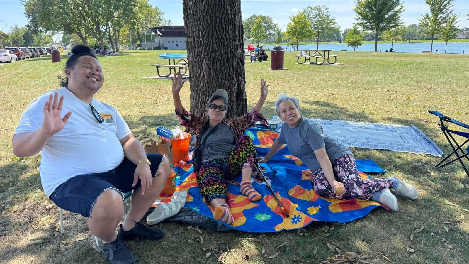 Church members playing a cornhole toss game at the picnic