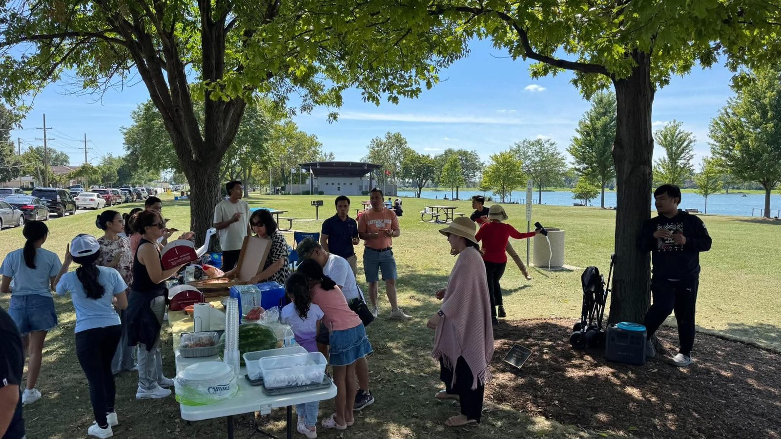 Church members smiling together at the Lake Opeka picnic